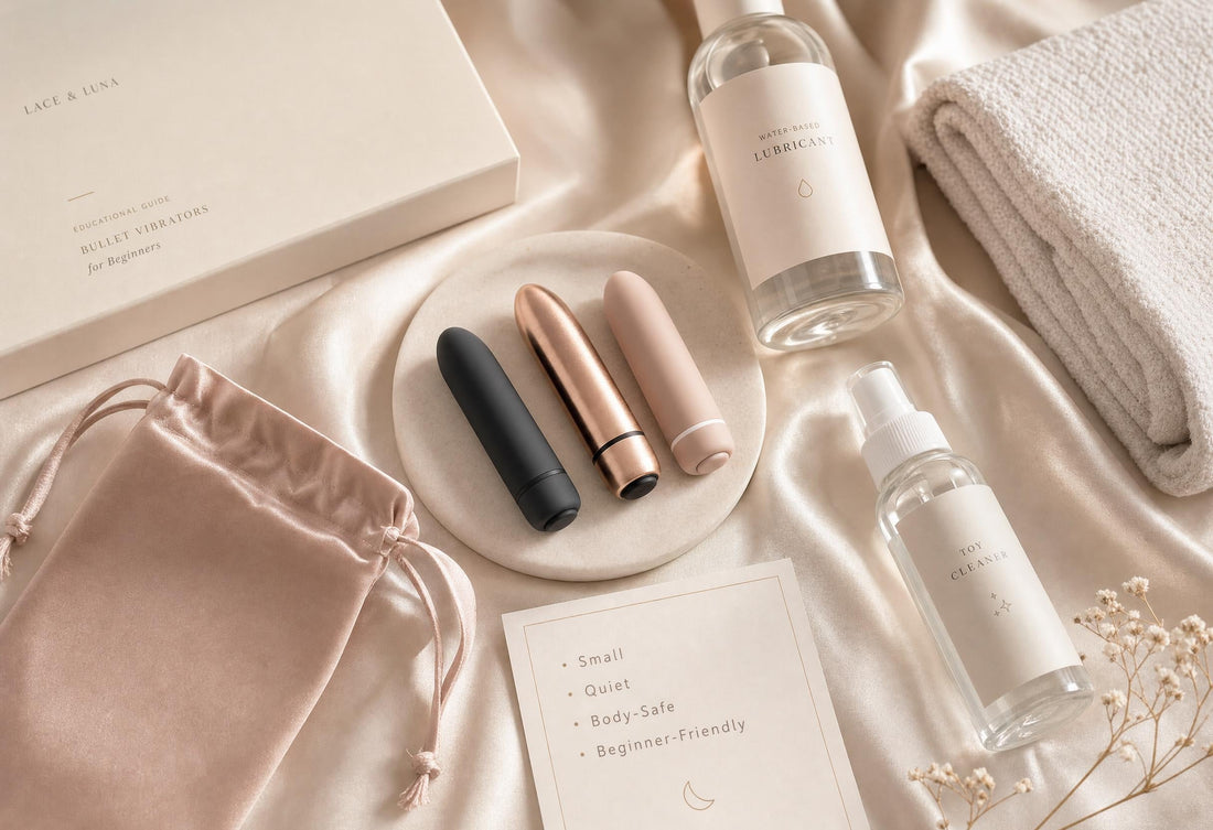 Luxury flat-lay of beginner-friendly bullet vibrators with water-based lubricant, toy cleaner, satin pouch, folded towel and note card.
