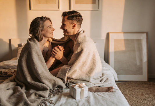 Couple relaxing together in a bedroom exploring intimacy and connection in a romantic setting