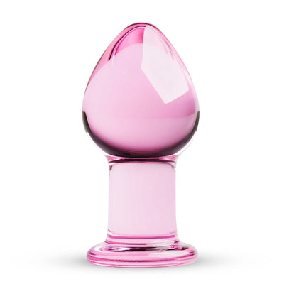 Pink glass butt plug with smooth tapered shape and rounded base